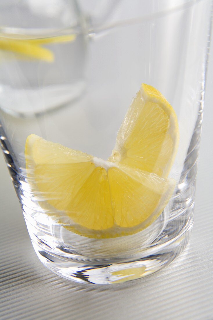 Glass of water with slices of lemon (close-up)