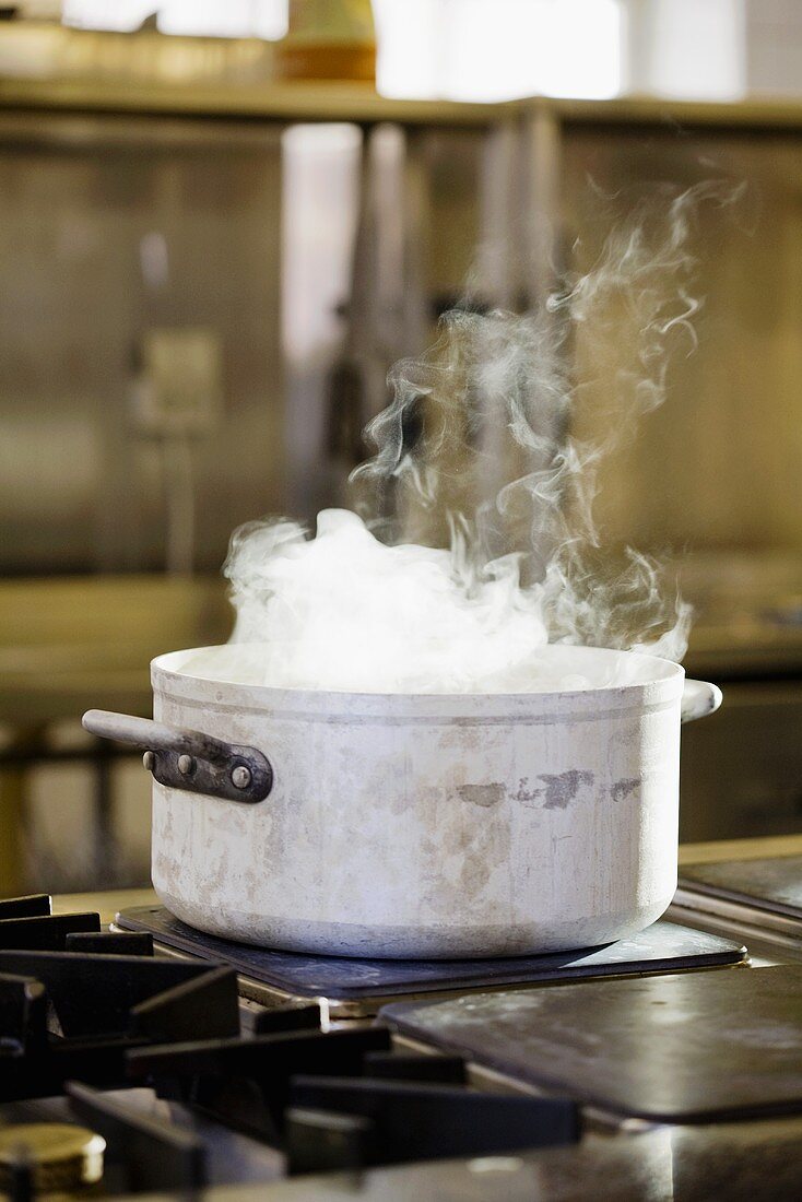 Steaming pan beside cooker