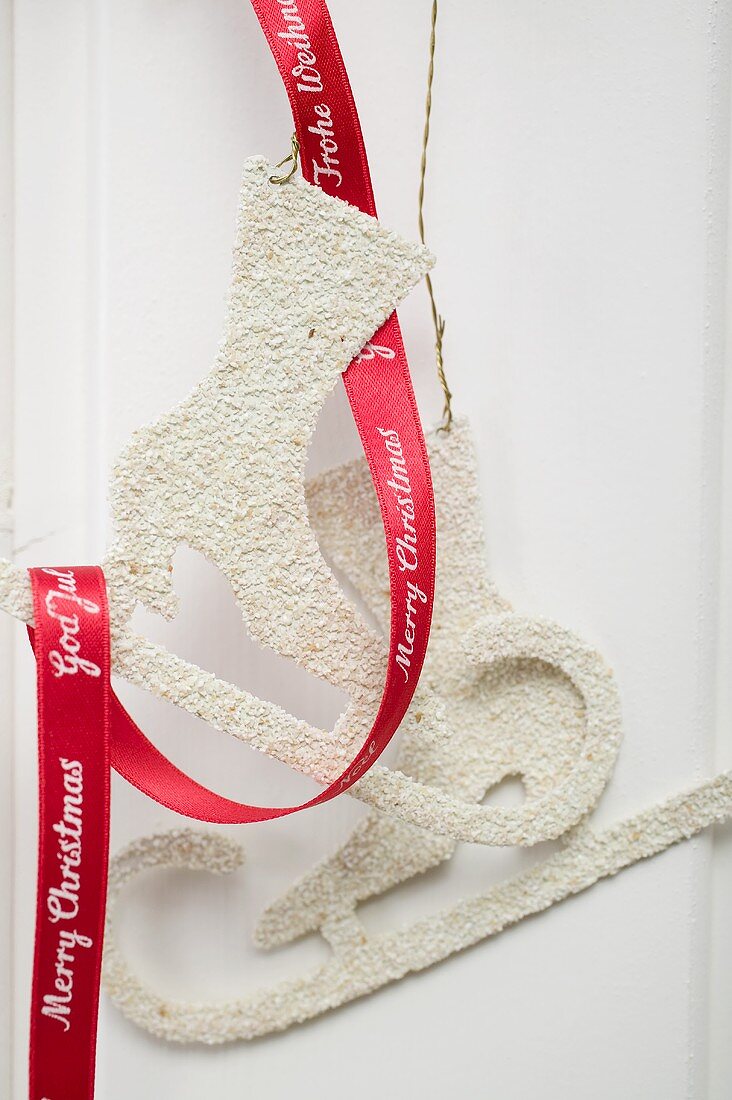 Christmas decoration: skates with red ribbon