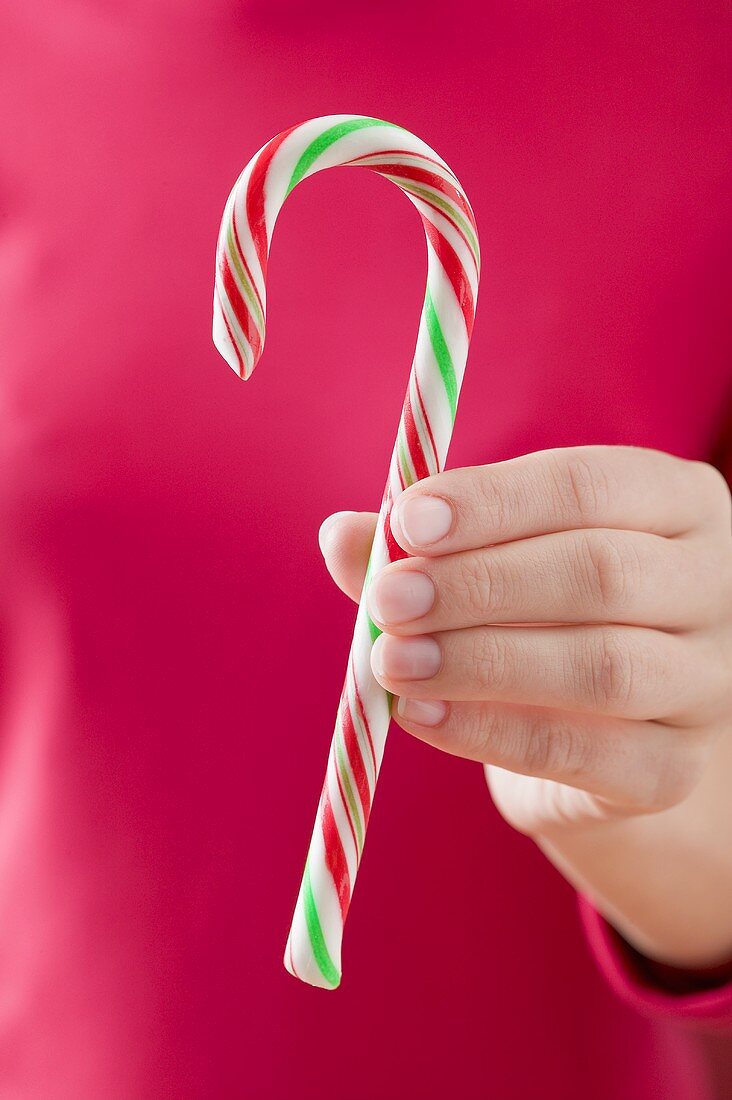 Woman holding candy cane