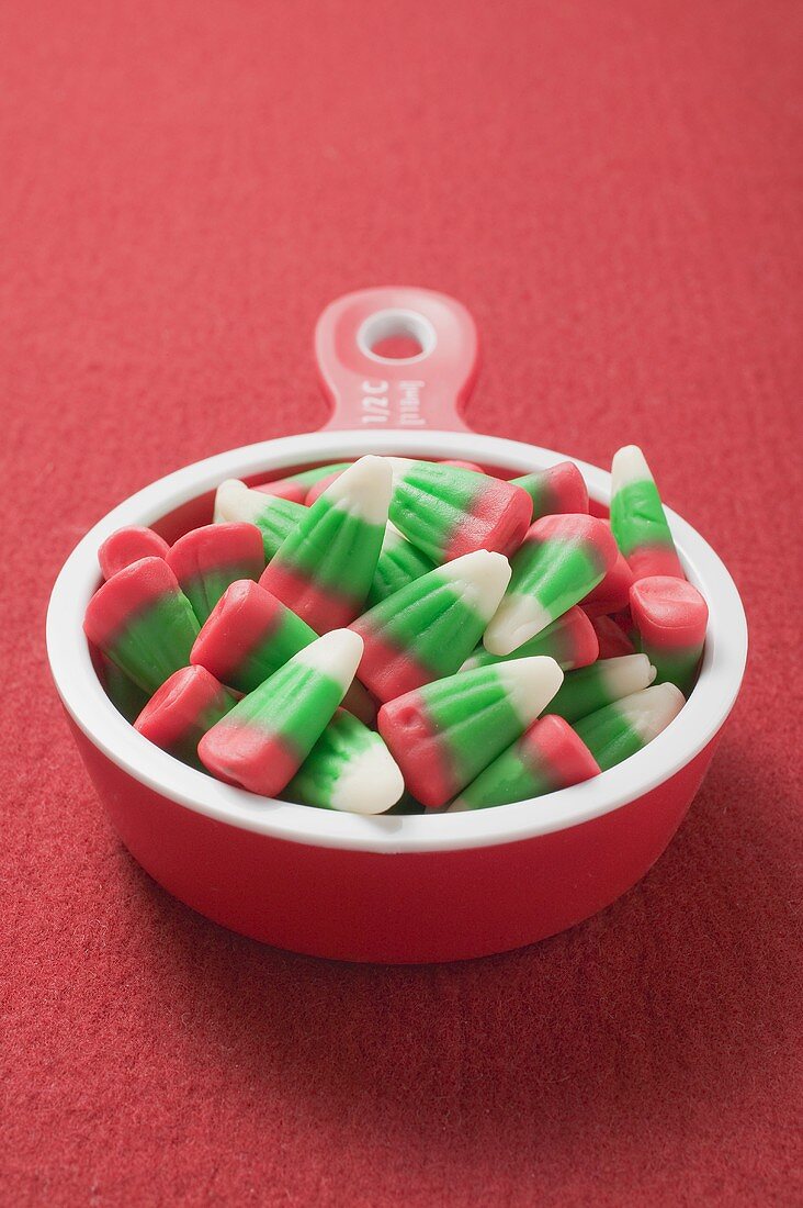 Candy corn in measuring cup (Christmas)