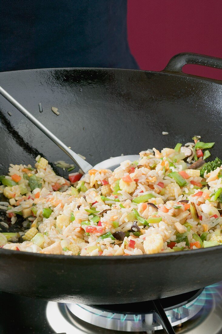 Frying vegetable rice in wok