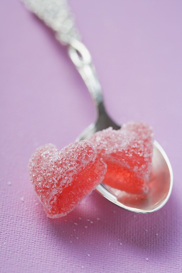 Two jelly hearts on silver spoon