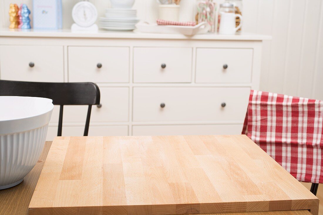 Kitchen scene with large chopping board on table