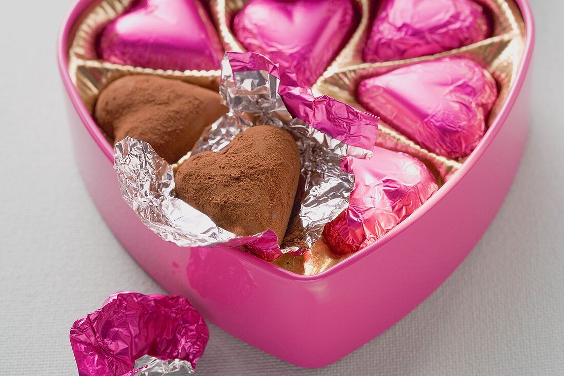 Pink chocolates in heart-shaped box