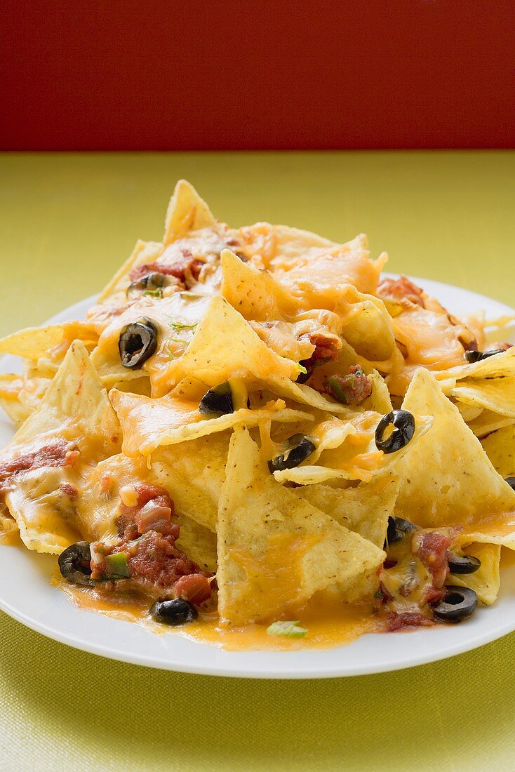 Nachos with melted cheese and olives (Mexico)