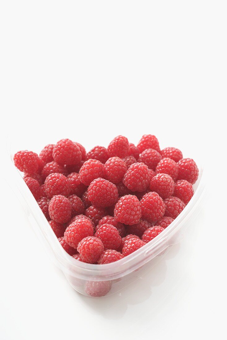 Raspberries in plastic container