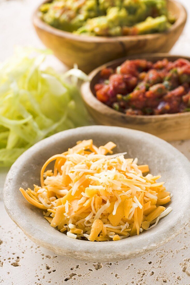 Grated cheese, guacamole and salsa