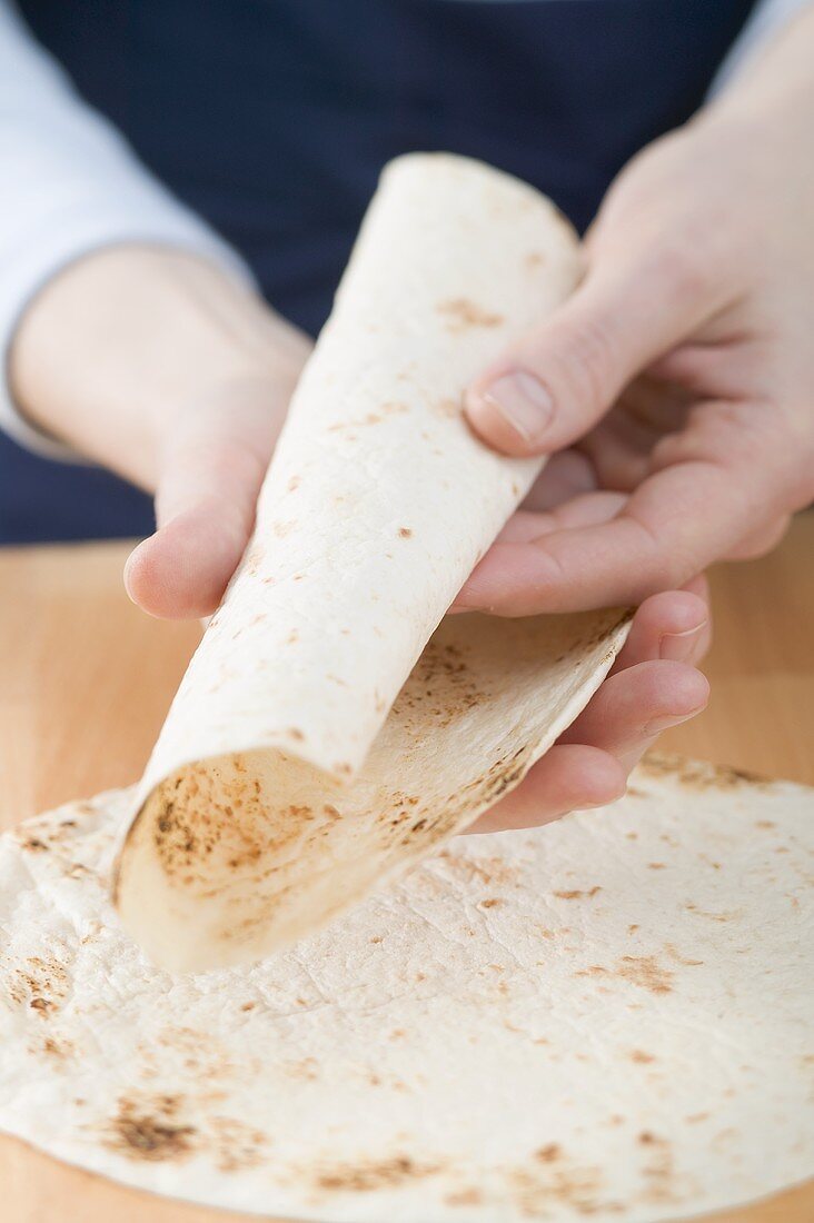 Rolling a tortilla
