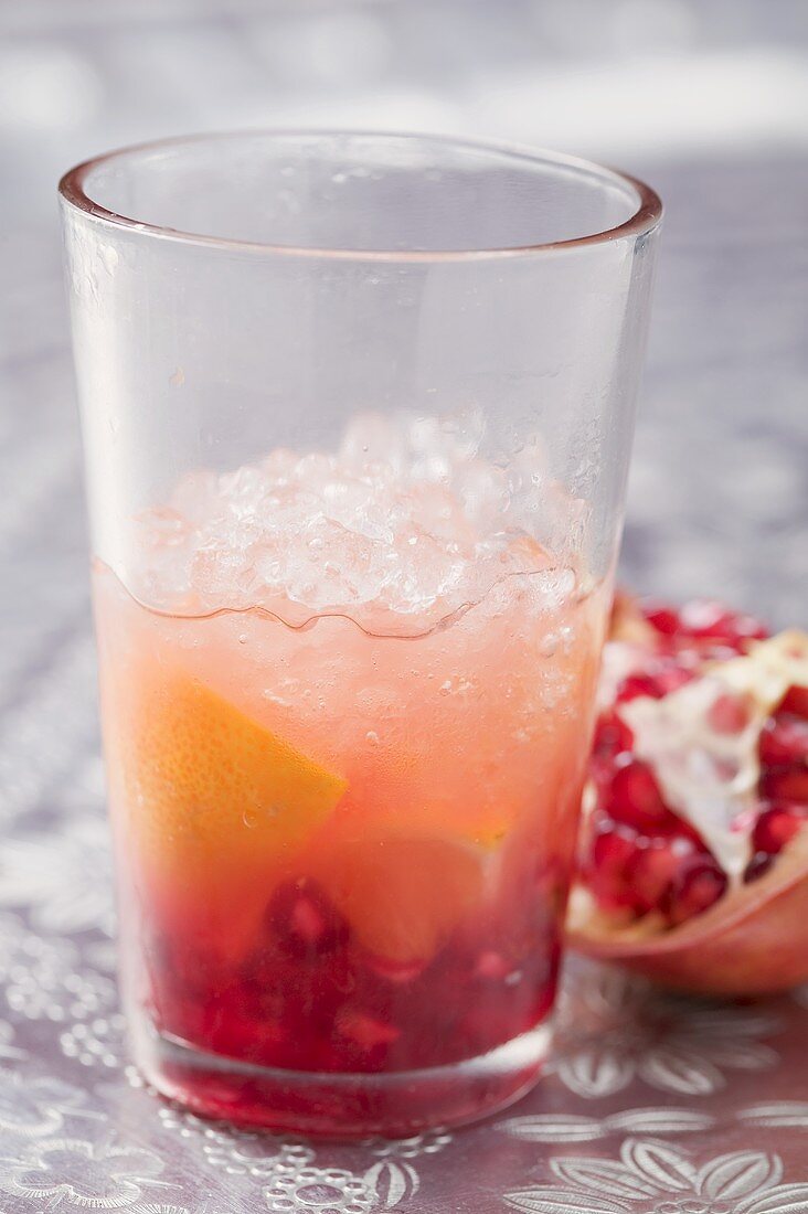 Fruity drink with orange and pomegranate