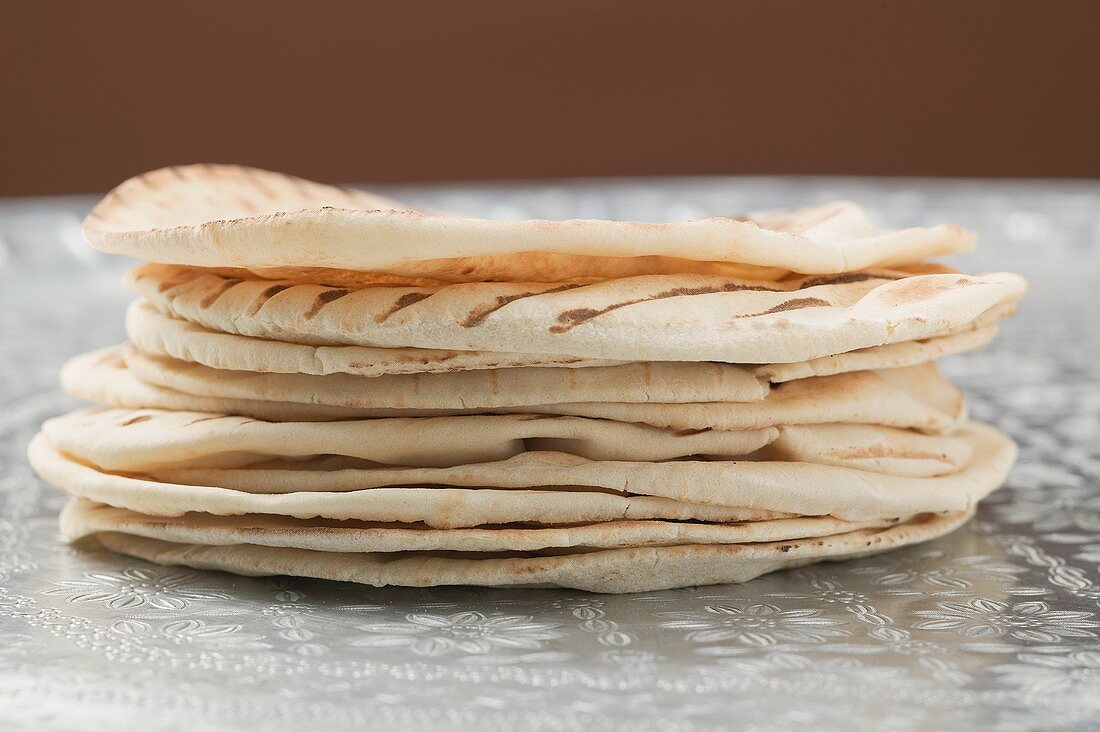 A stack of grilled flatbread