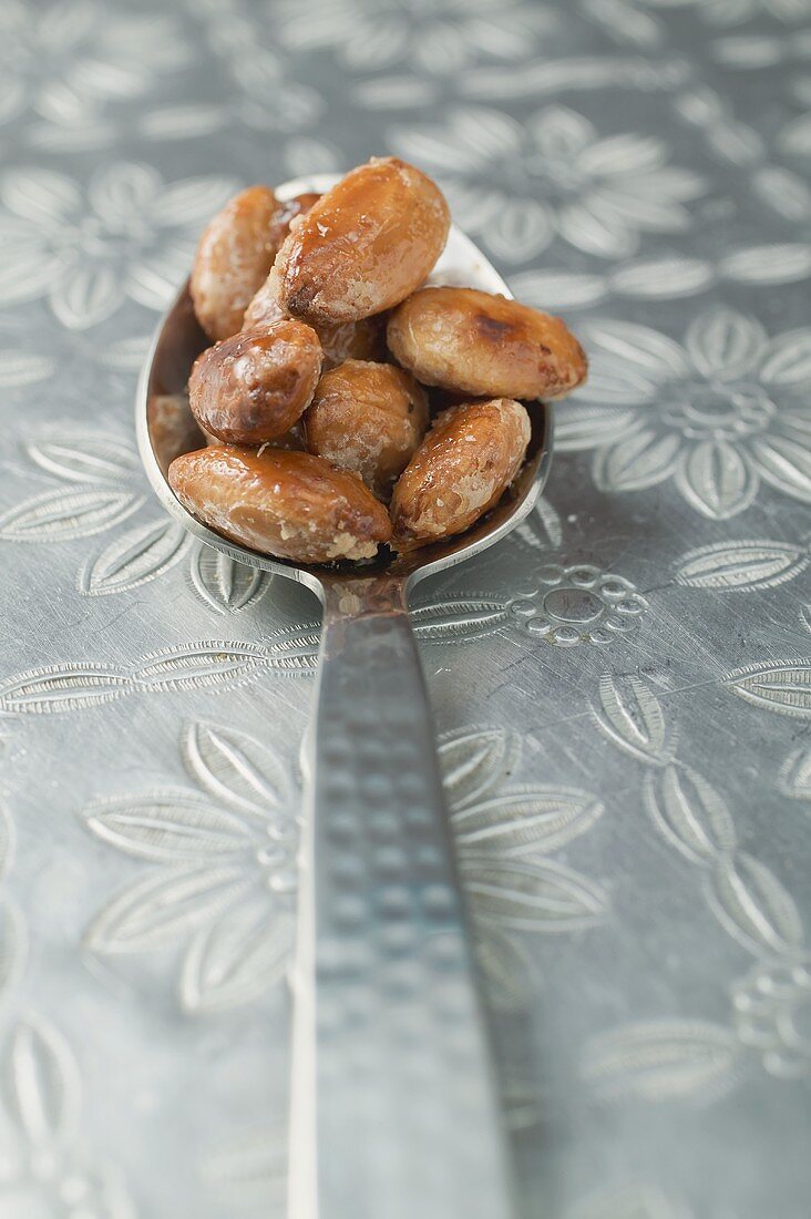 Roasted almonds on spoon