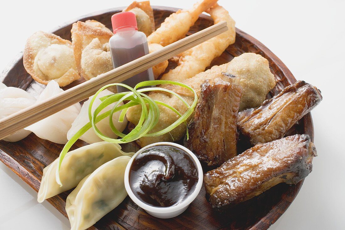 Plate of Asian appetisers with dip