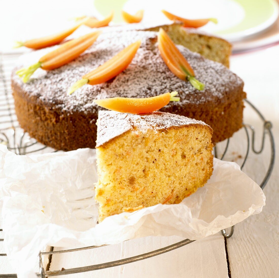 Carrot cake decorated with fresh carrots
