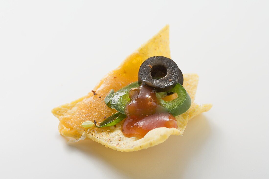 Nacho with cheese, olive, chilli ring and ketchup