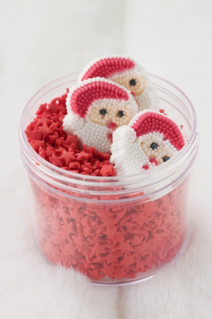 Father Christmases and red sugar stars in a jar