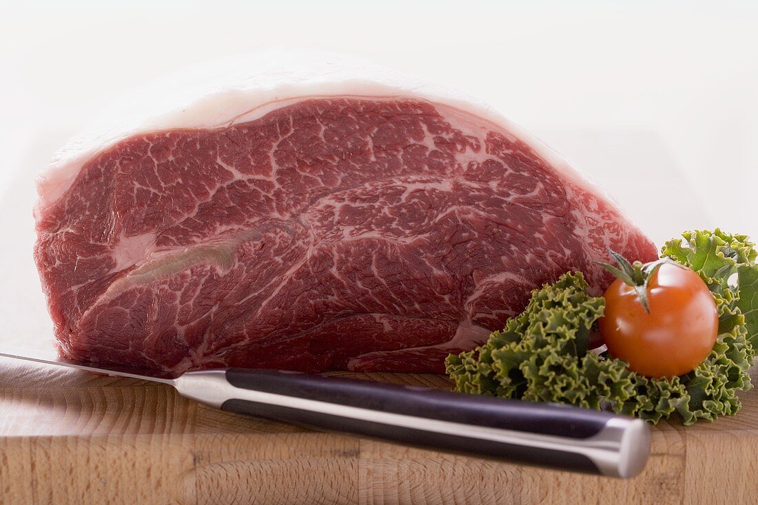 Fresh beef on chopping board