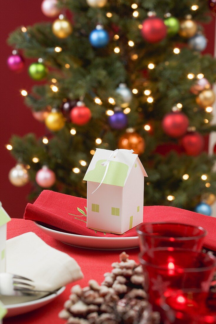 Festive table in front of Christmas tree