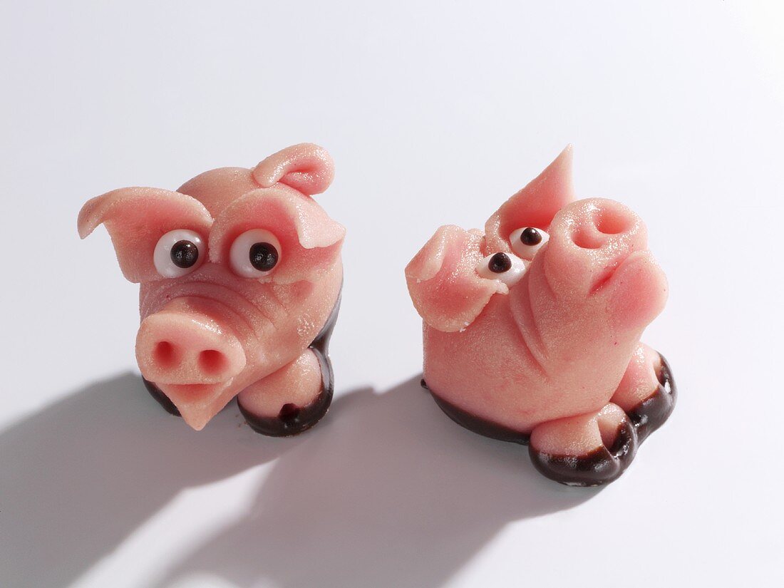 Two marzipan pigs