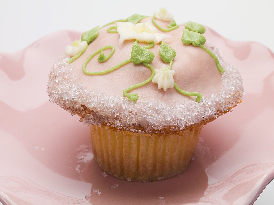 Cupcake with pink icing and buttercream flowers