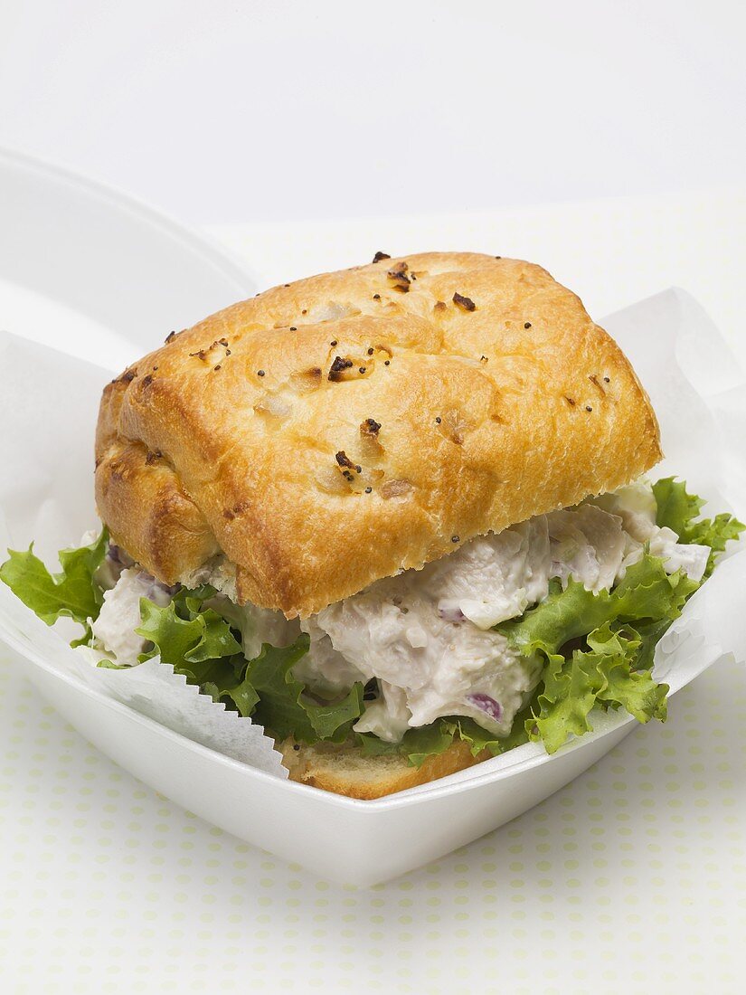 Chicken salad sandwich in polystyrene container