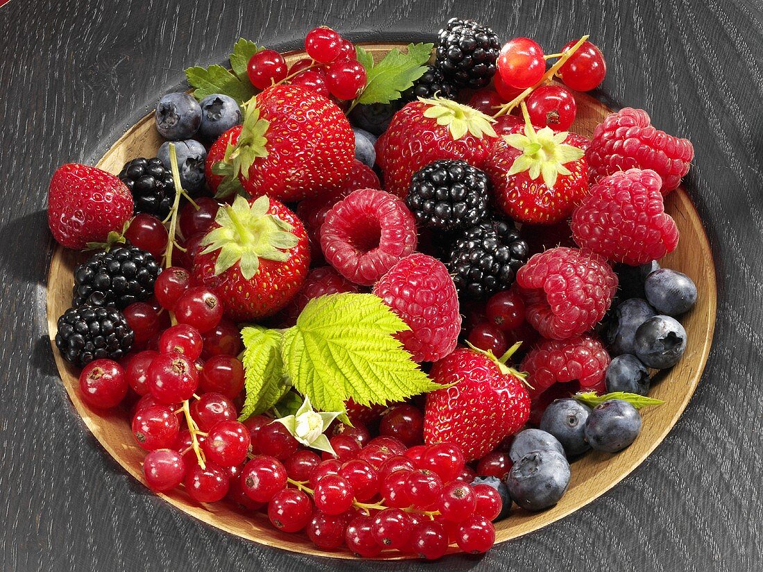 Assorted berries in wooden bowl