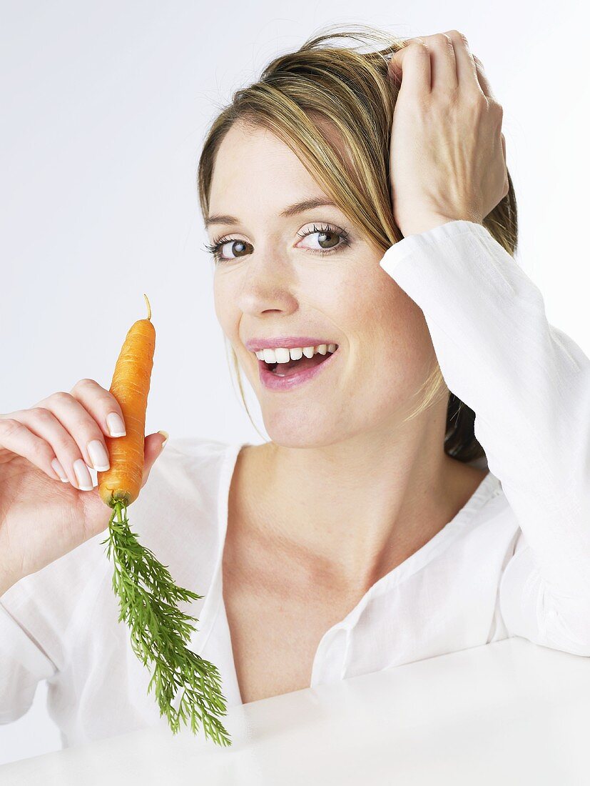 Woman holding a carrot