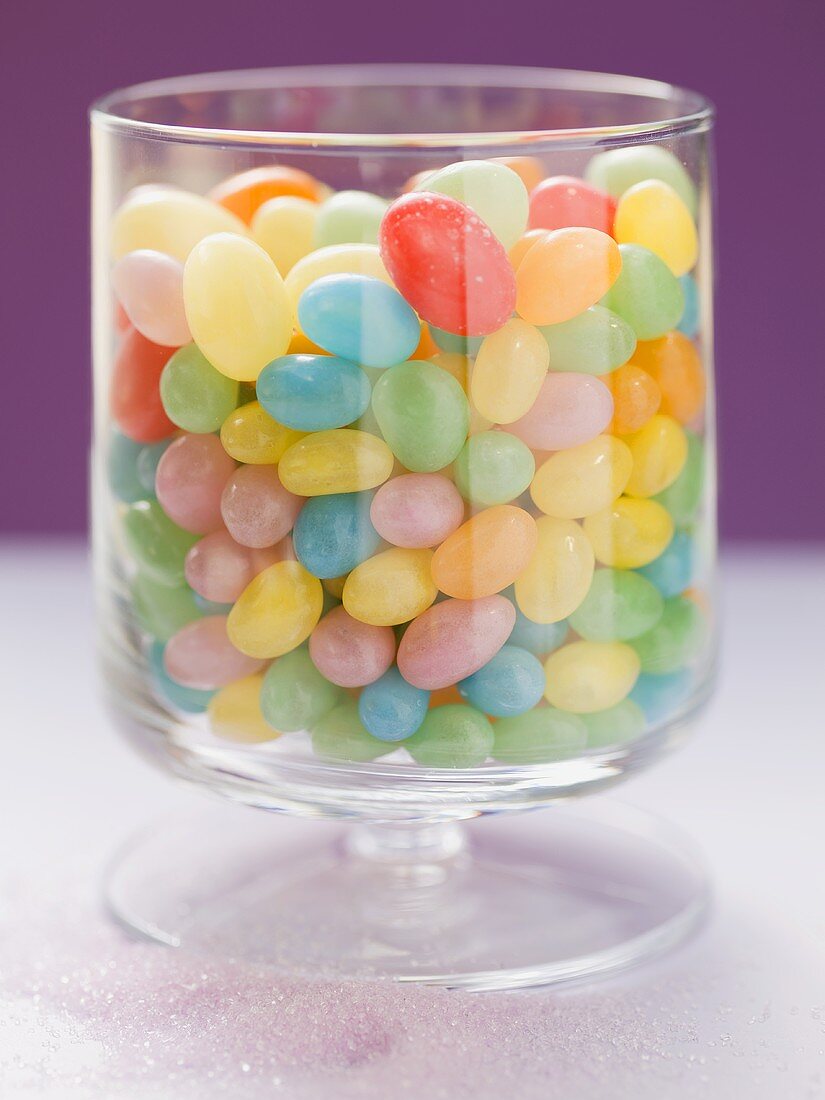Coloured jelly beans in glass