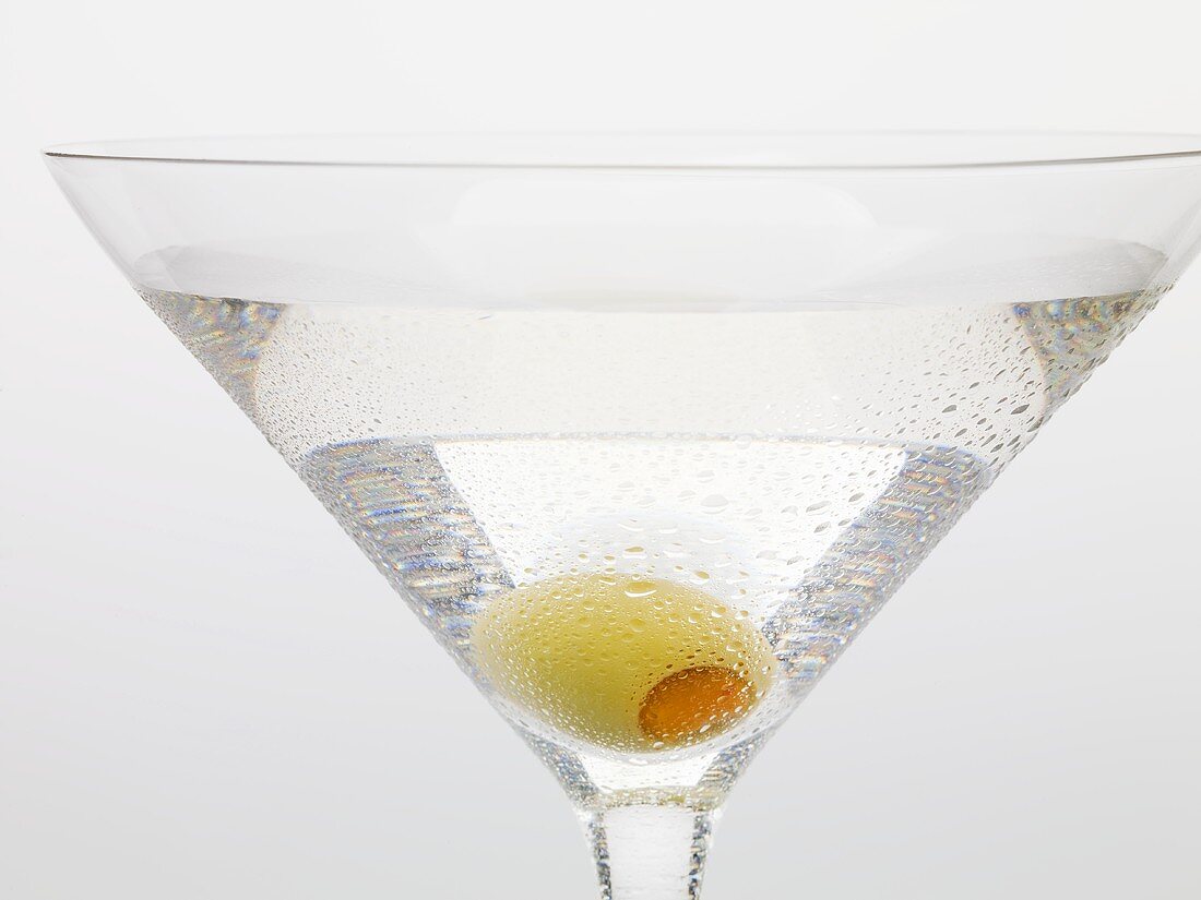 Martini with green olive (close-up)