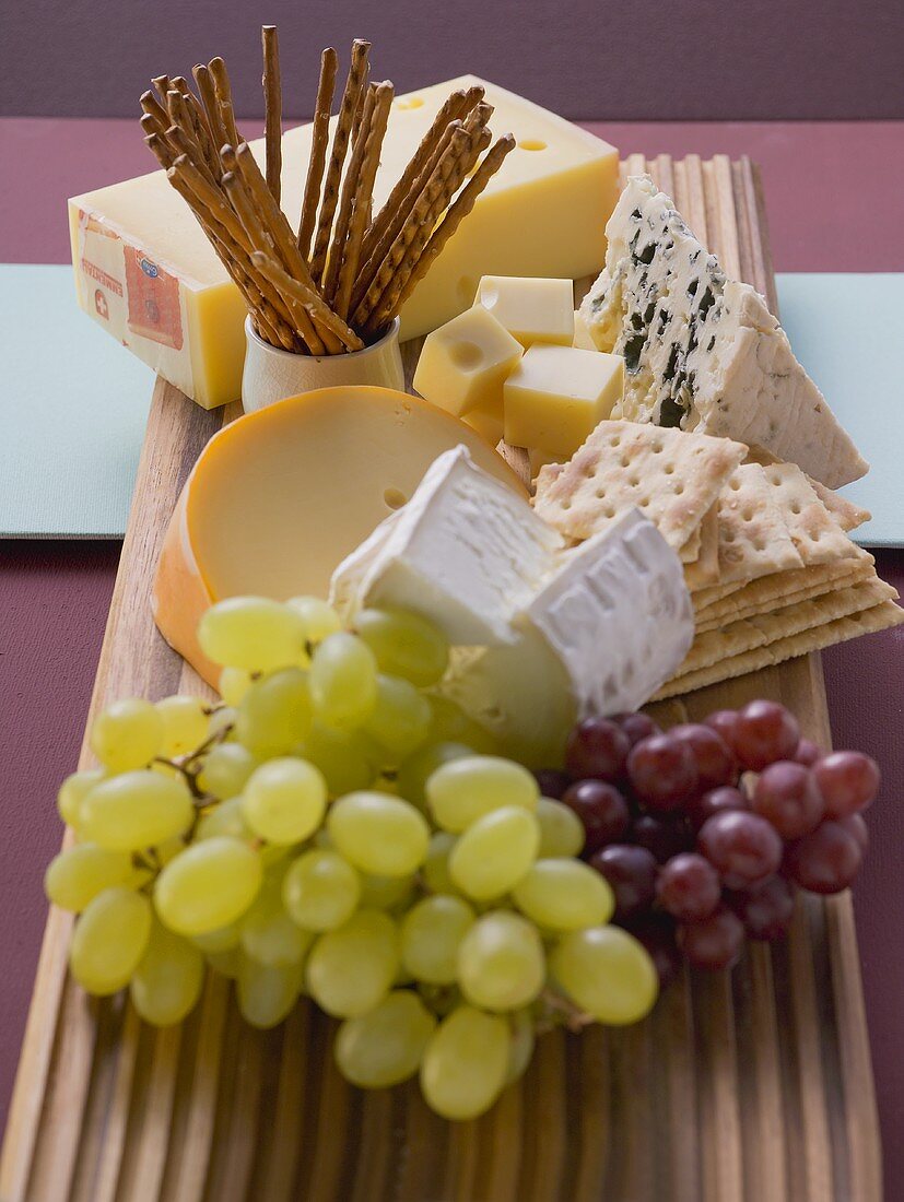 Cheese board with grapes and nibbles