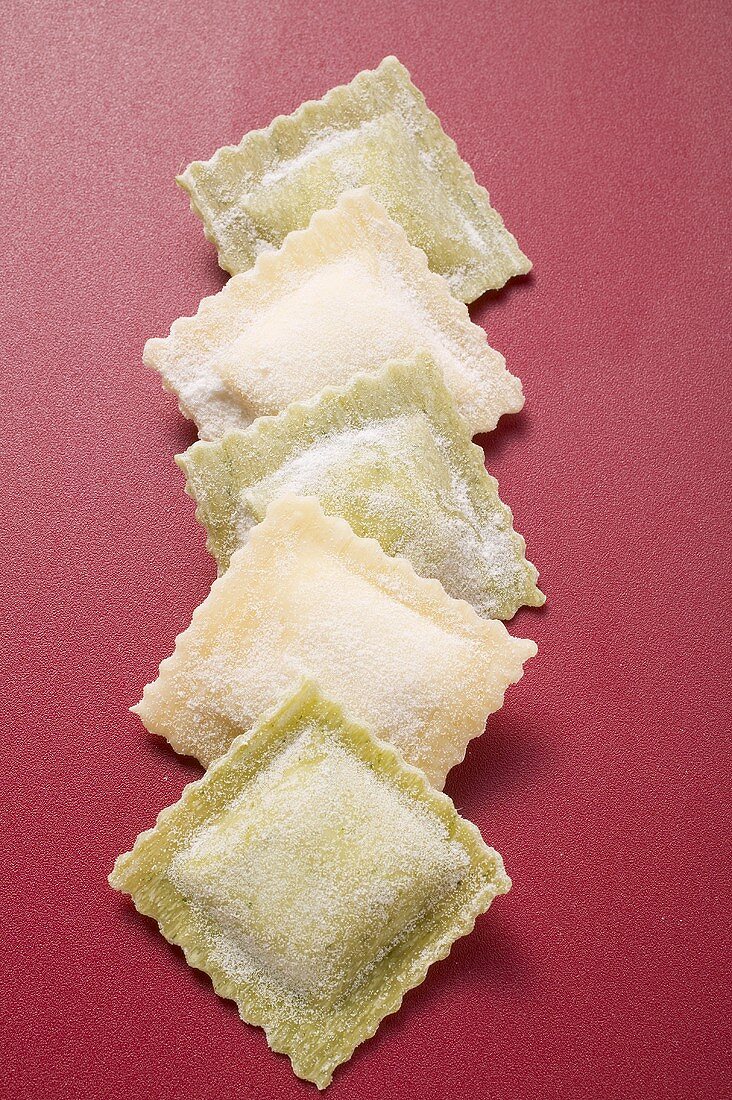 Home-made ravioli in a row
