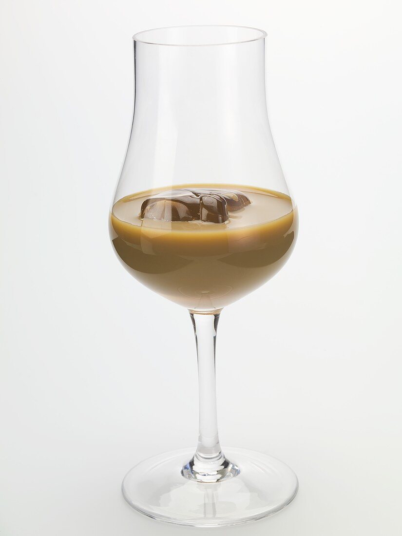 Cream liqueur with ice cubes in a glass
