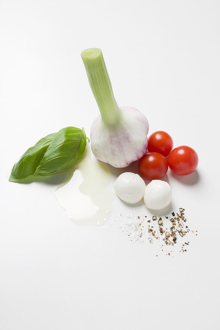 Garlic, tomatoes, mozzarella, spices, oil and basil