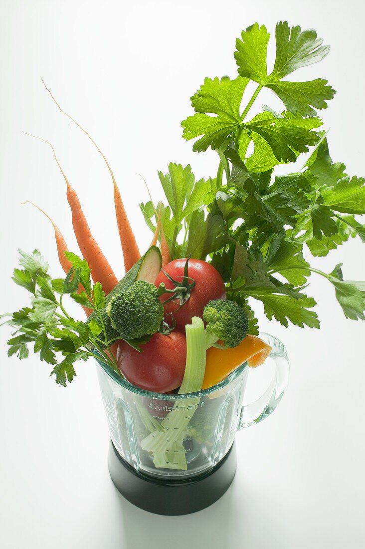 Fresh vegetables and parsley in a liquidiser