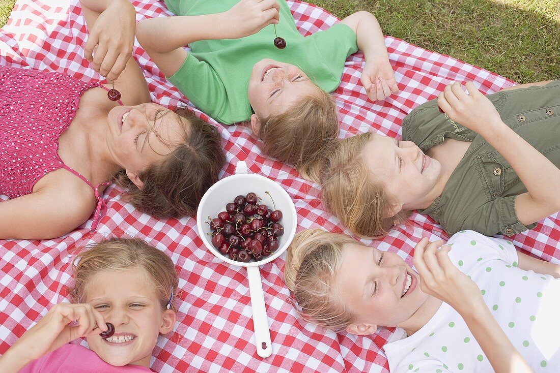 Children eating cherries