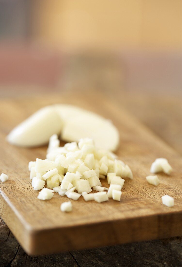 Chopped garlic on chopping board