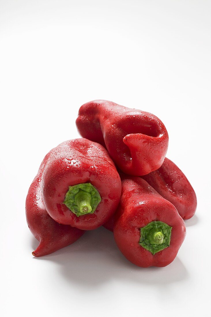 Several red pointed peppers