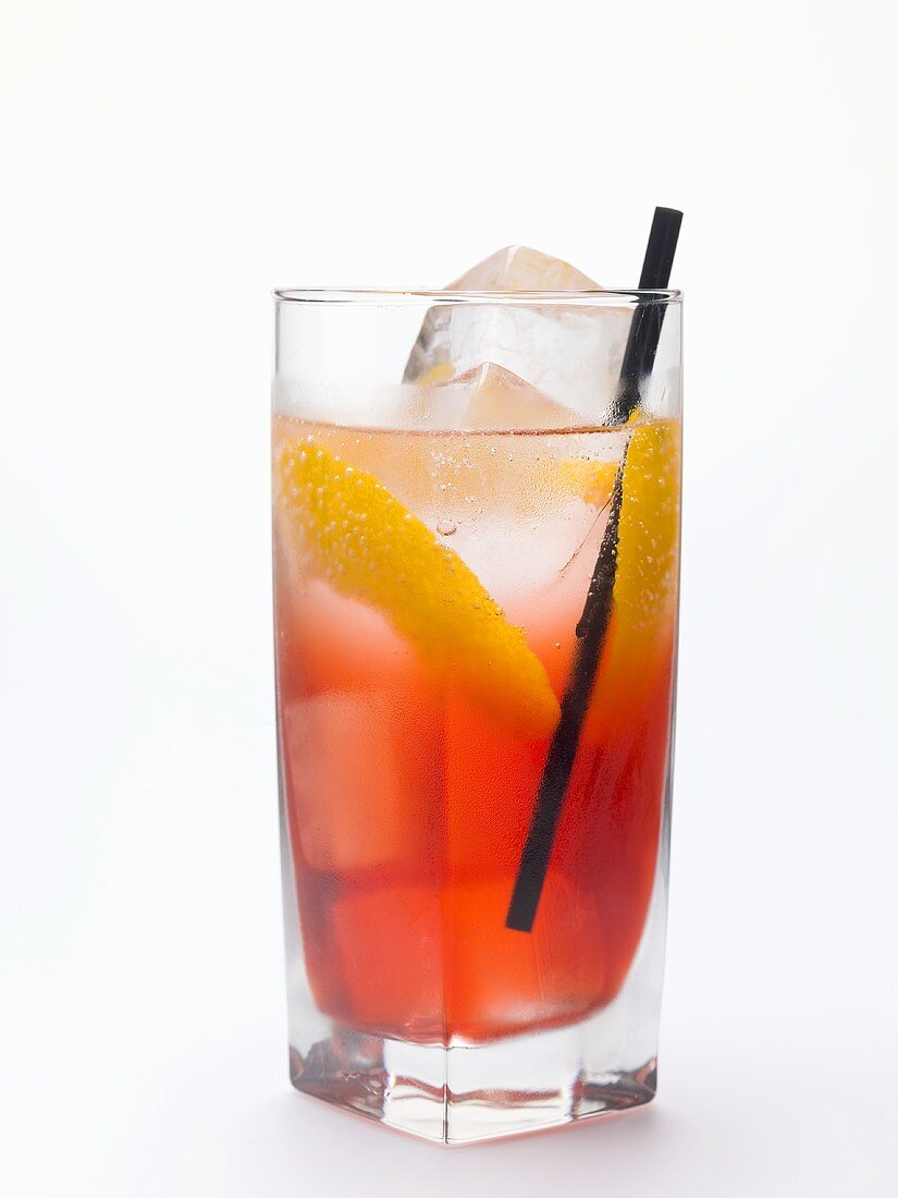 Campari Soda with lemon peel and ice cubes