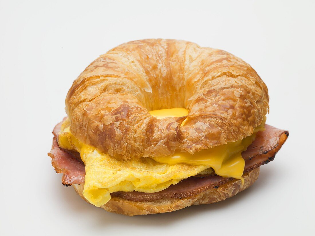Croissant filled with scrambled egg, cheese and bacon