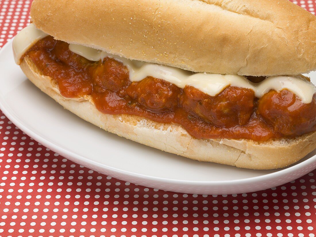 Meatball sub sandwich with tomato sauce and cheese
