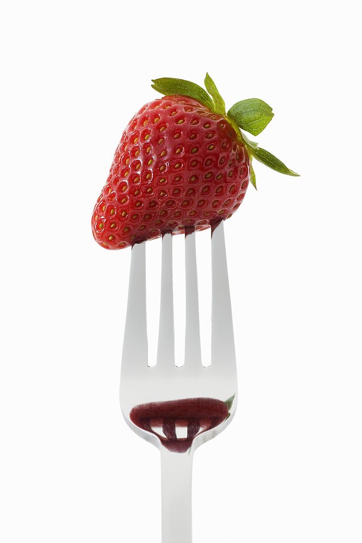 A strawberry on a fork