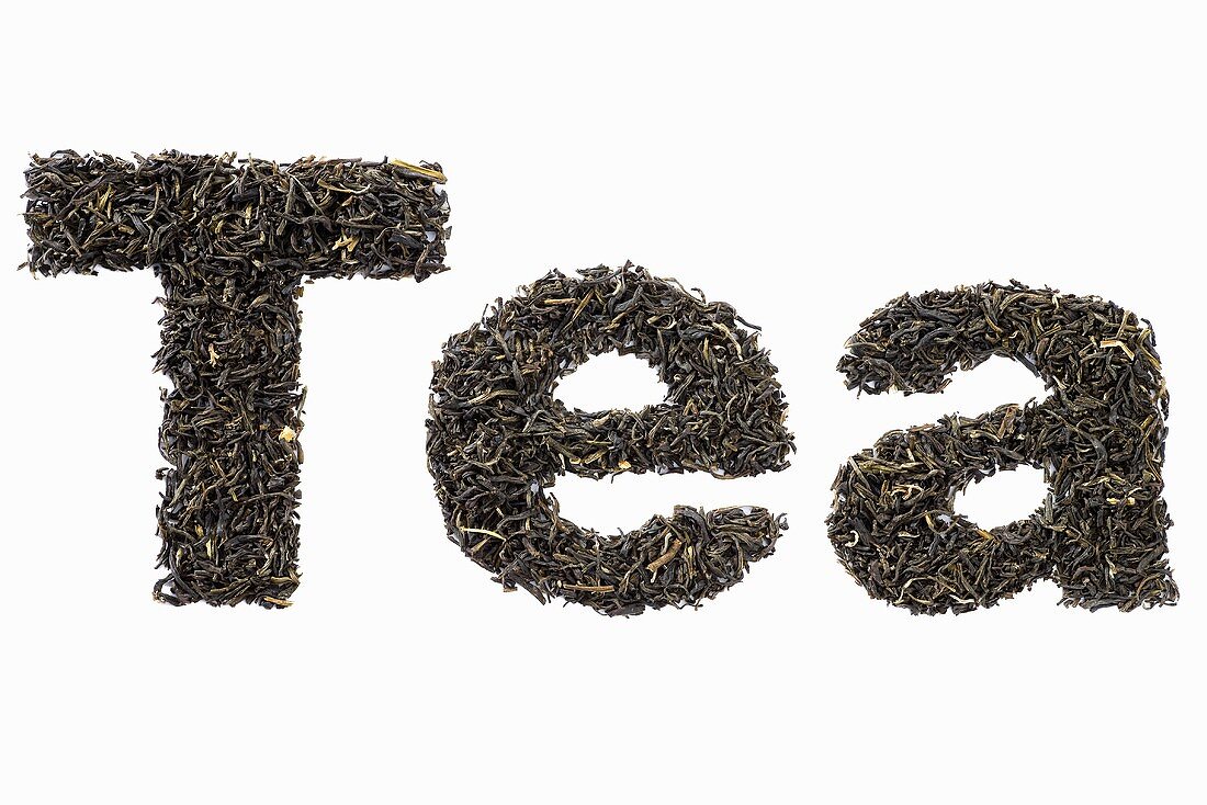 The word Tea written in dried tea leaves