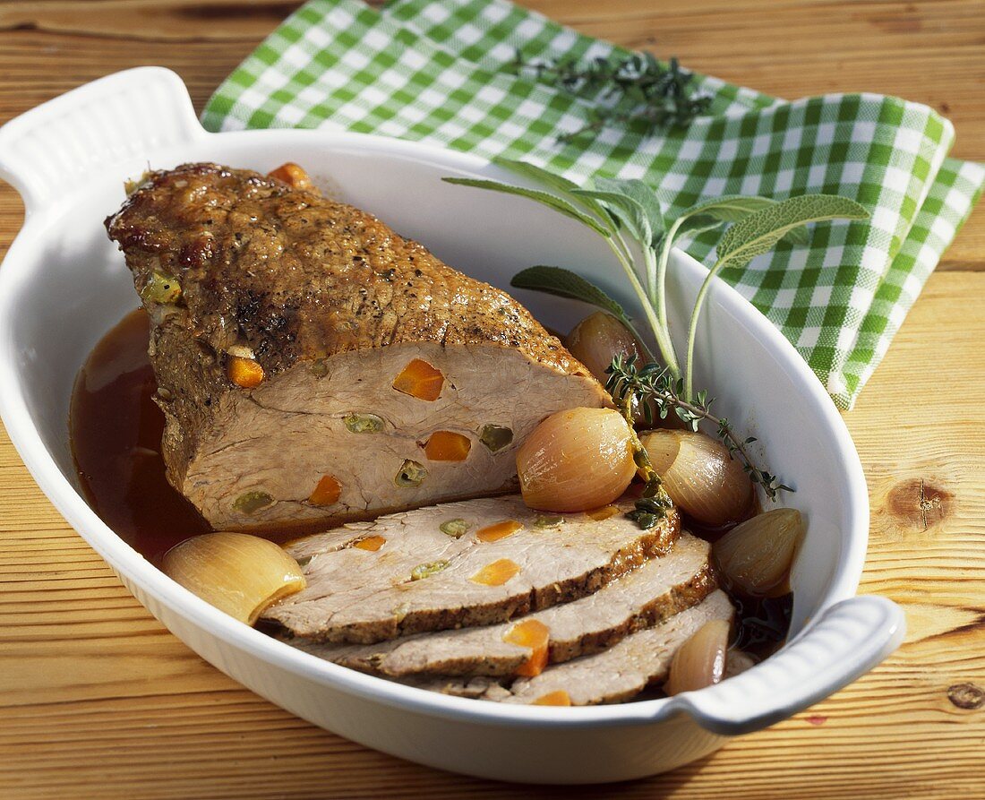 Roast veal studded with vegetables