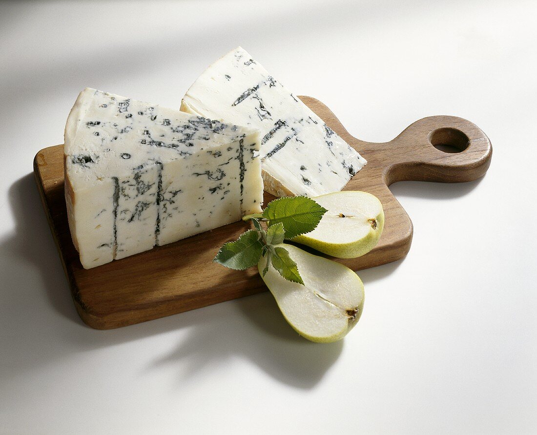 Blue cheese and pear on a wooden board