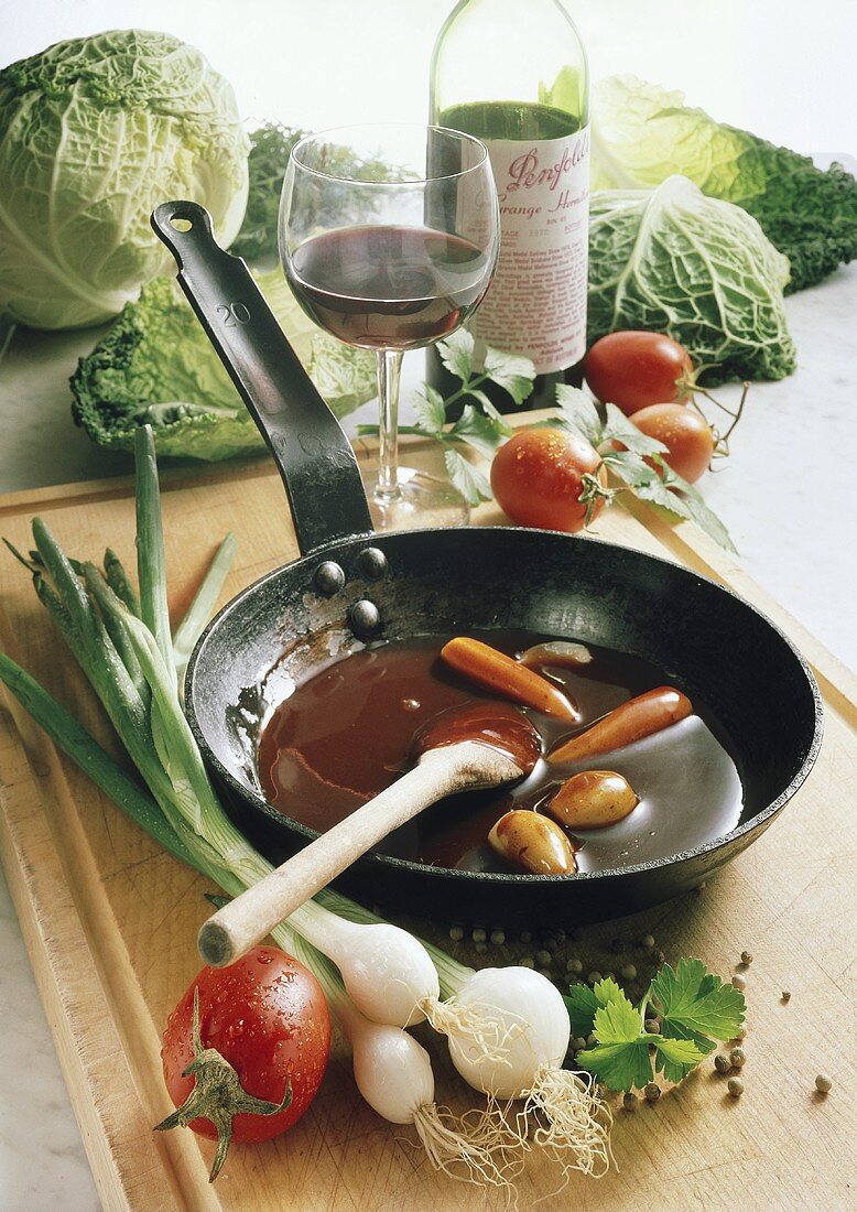 Burgundy sauce in a frying pan with vegetables