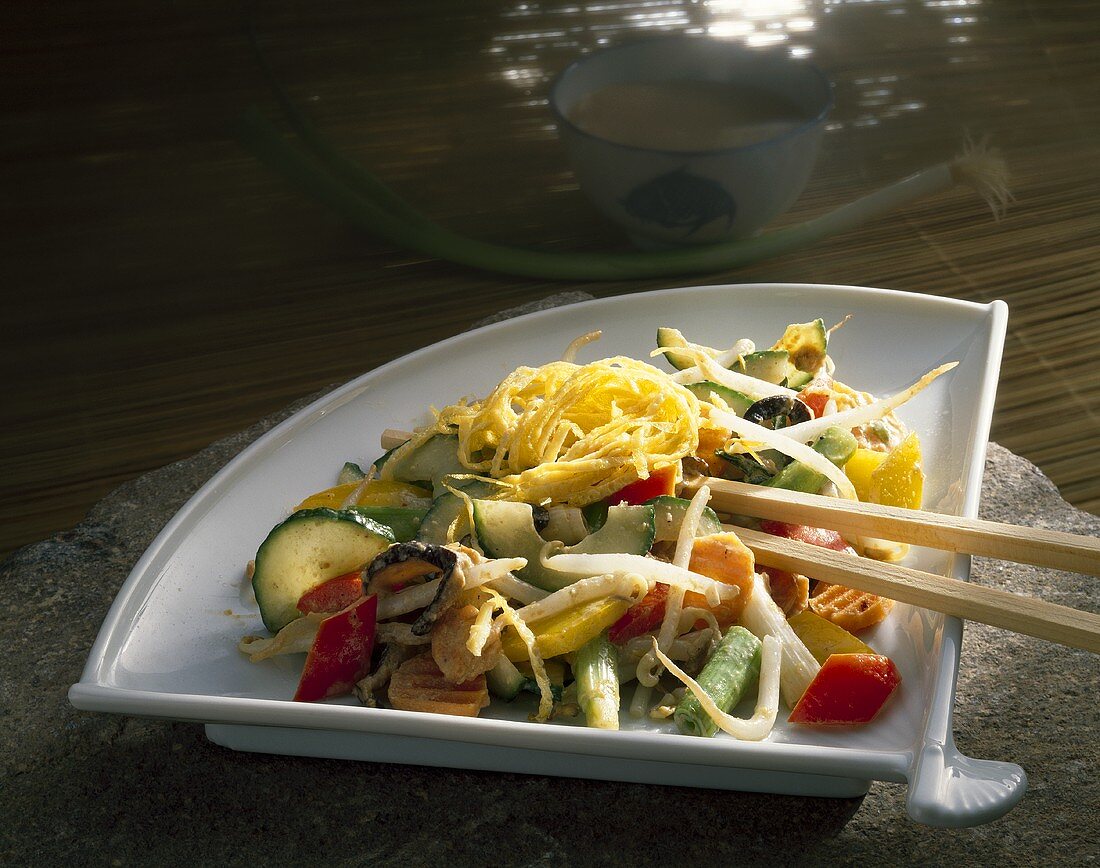 Asian vegetable salad with strips of omelette