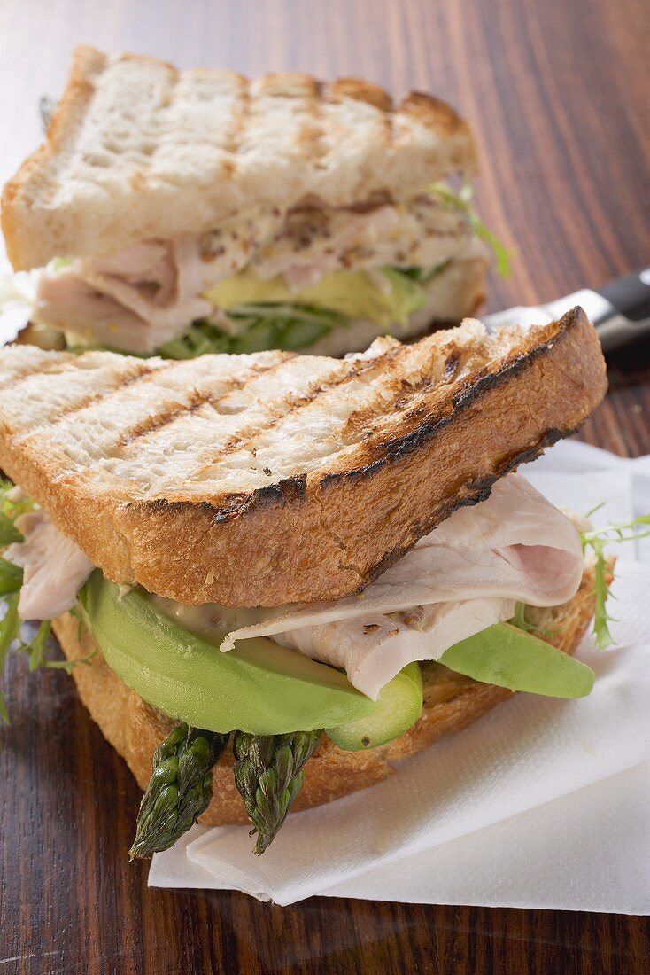 Turkey, avocado and asparagus in toast sandwich