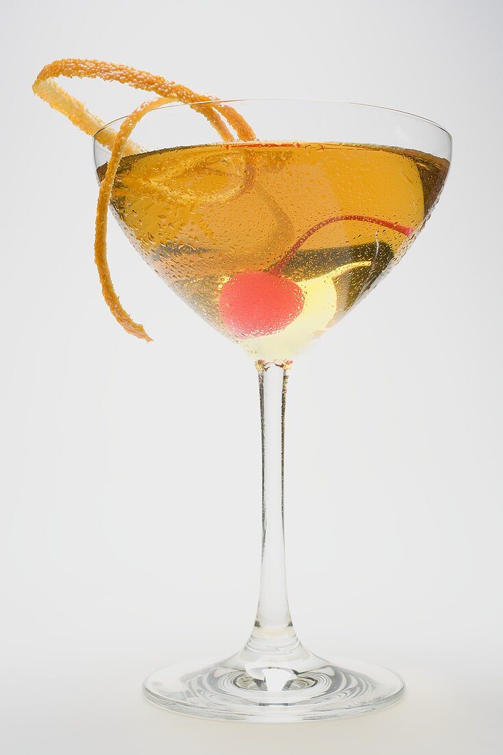 Manhattan with cocktail cherry and orange zest
