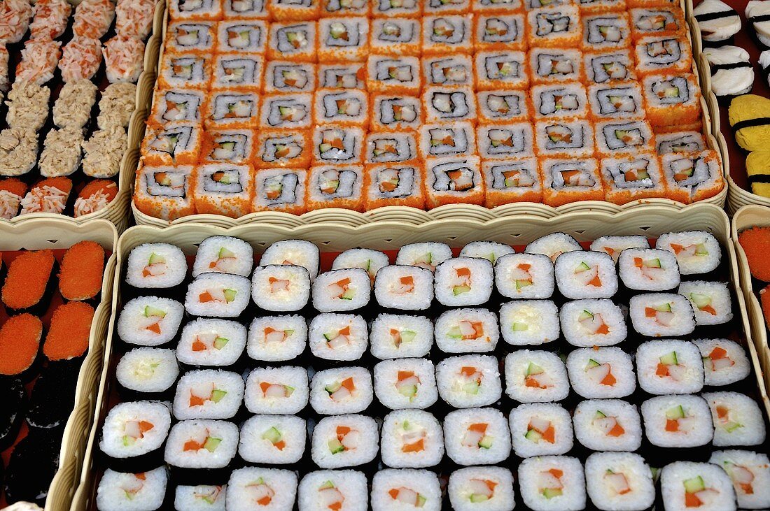 Assorted sushi on trays