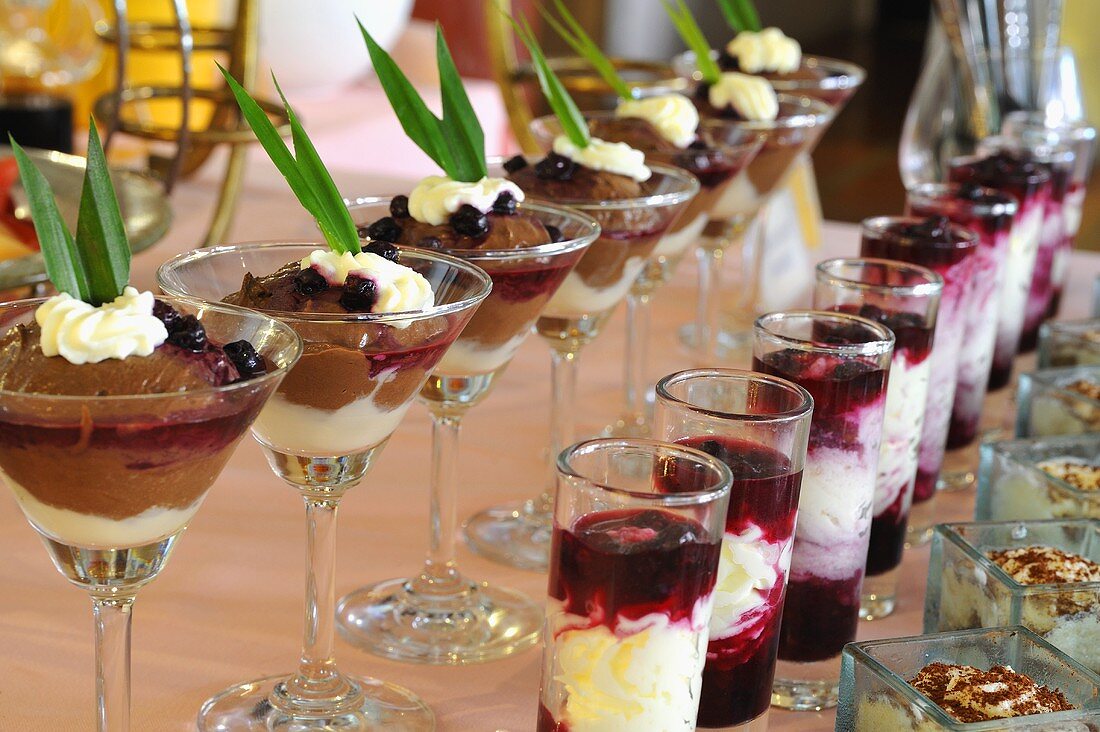 Chocolate mousse with cream, lemon cream with blueberries, cherries